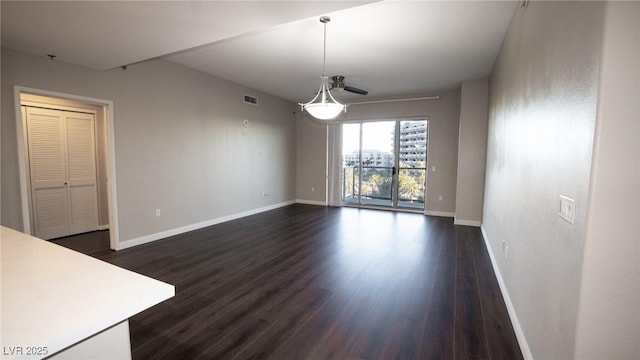 8255 Las Vegas Blvd Unit 415, Las Vegas, NV 89123 - unfurnished living room featuring dark wood-style floors