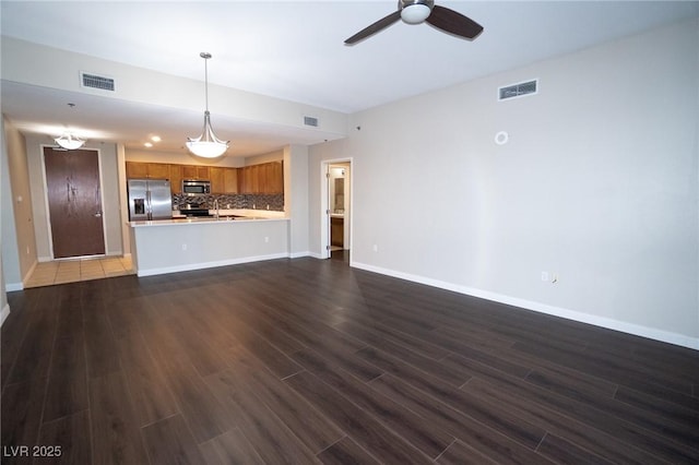 8255 Las Vegas Blvd Unit 415, Las Vegas, NV 89123 - unfurnished living room with dark wood-type flooring and ceiling fan