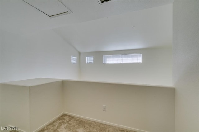 unfurnished room with light carpet and baseboards