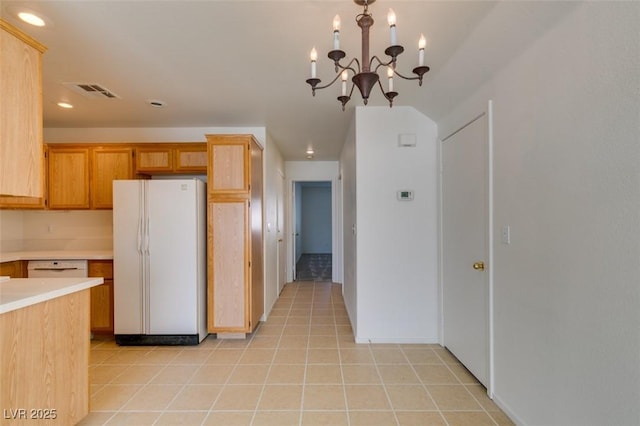 kitchen featuring white appliances, visible vents, light countertops, and light tile patterned flooring