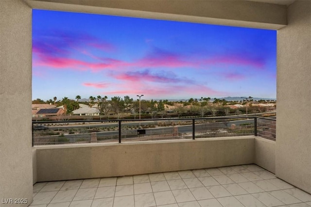 view of balcony at dusk