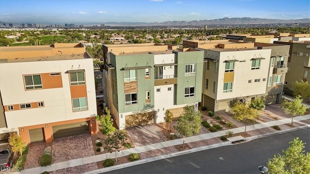 birds eye view of property with a residential view and a mountain view