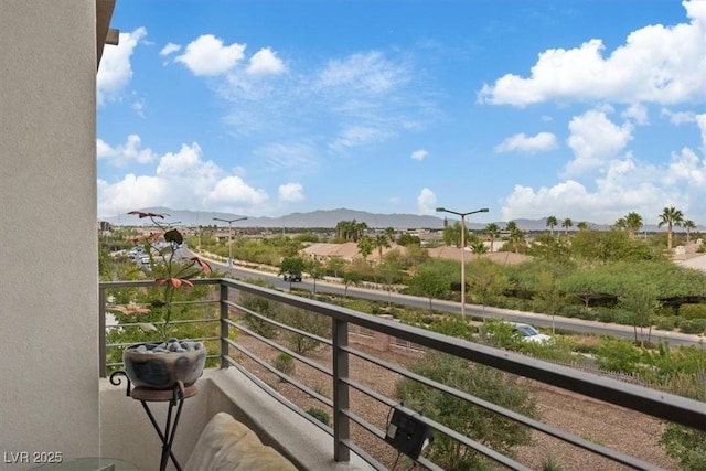 balcony featuring a mountain view