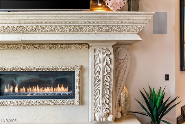 details featuring a tile fireplace