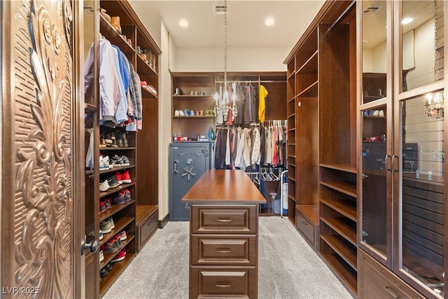 spacious closet with carpet flooring and visible vents