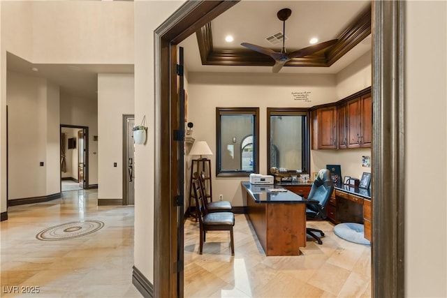 home office with a ceiling fan, visible vents, a towering ceiling, and baseboards