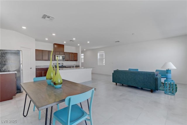 dining space with recessed lighting and visible vents