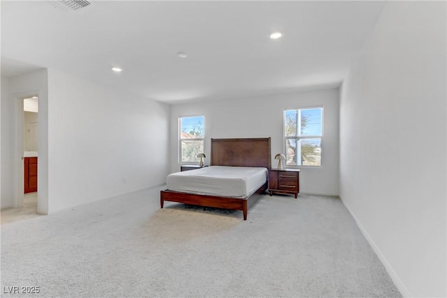 bedroom with recessed lighting, light colored carpet, visible vents, and baseboards