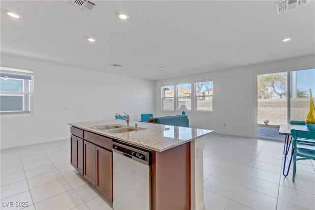 kitchen with a sink, visible vents, open floor plan, and stainless steel dishwasher