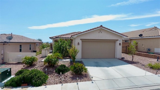 view of front of home with a garage, driveway, a tile roof, and stucco siding