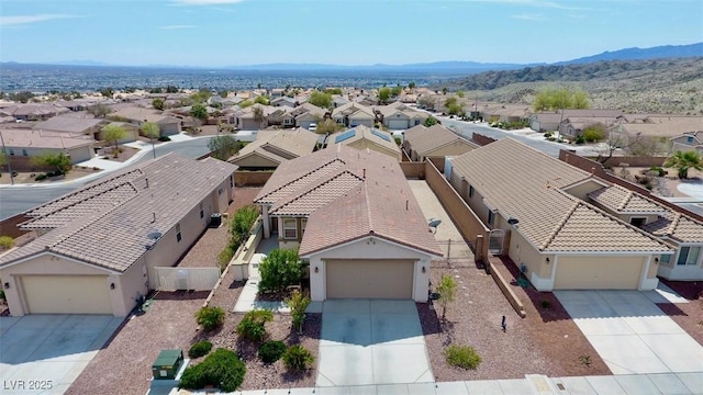 drone / aerial view featuring a mountain view and a residential view