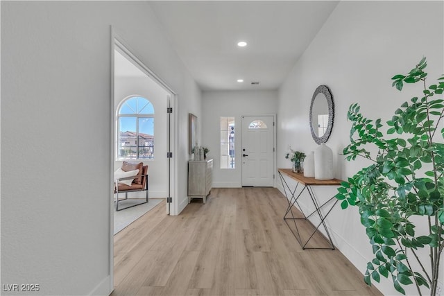 entrance foyer with baseboards, recessed lighting, and light wood-style floors