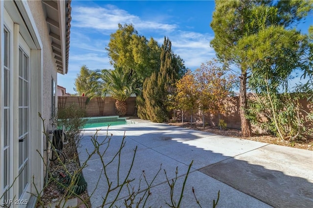 view of pool with a patio area and a fenced backyard