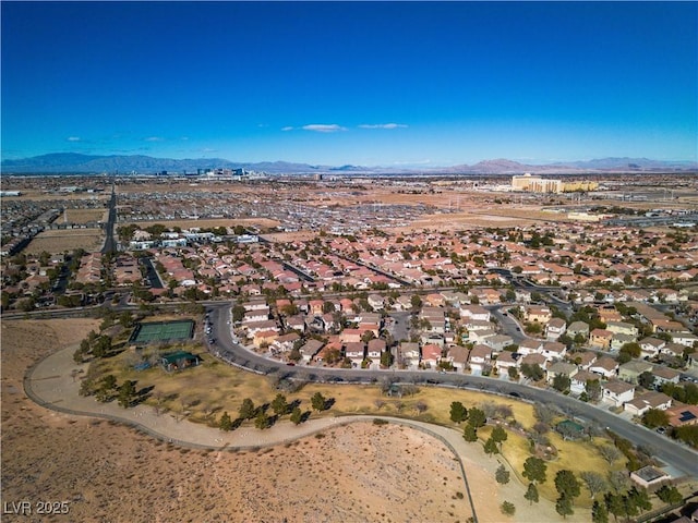 drone / aerial view featuring a residential view and a mountain view