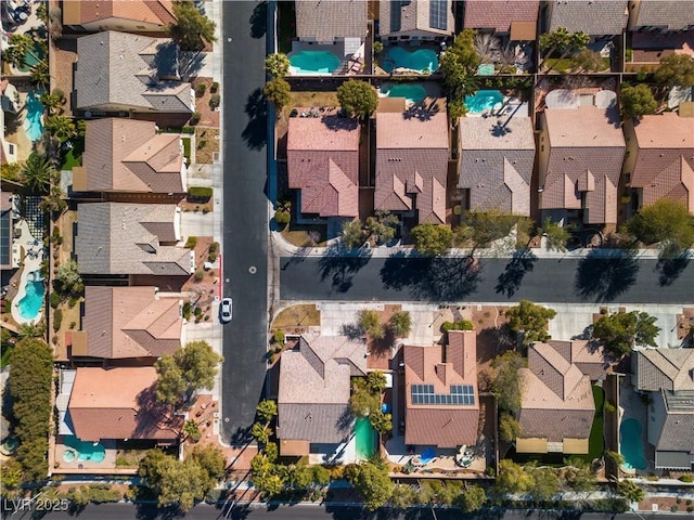 birds eye view of property with a residential view