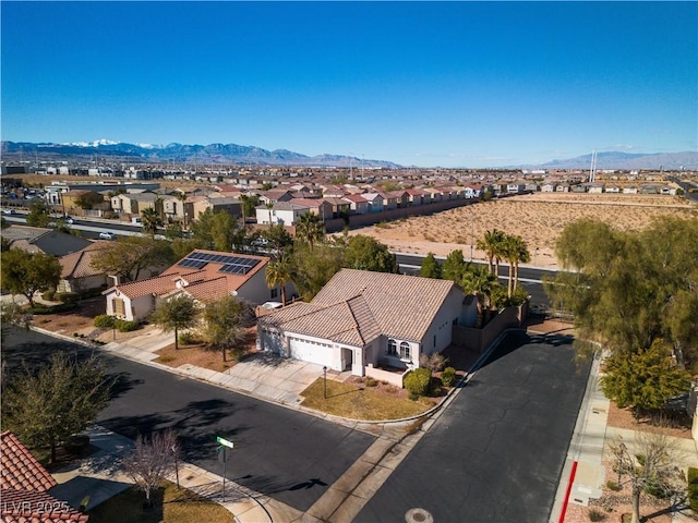 bird's eye view with a residential view and a mountain view