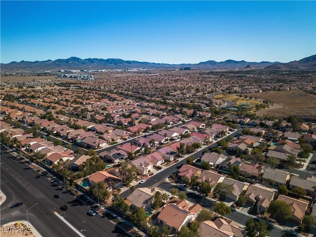 drone / aerial view featuring a residential view and a mountain view