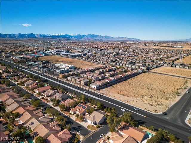 drone / aerial view featuring a residential view and a mountain view