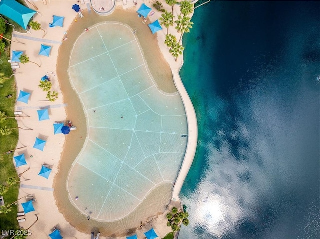 birds eye view of property with a water view