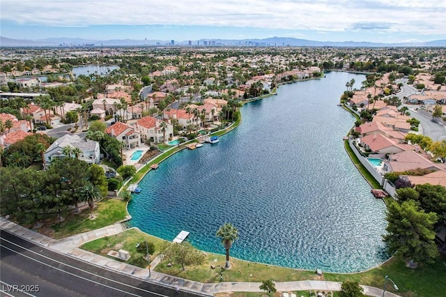 birds eye view of property featuring a residential view and a water and mountain view