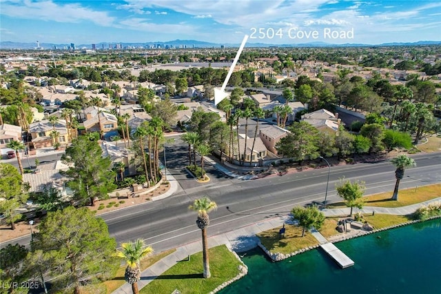 drone / aerial view with a residential view and a water and mountain view