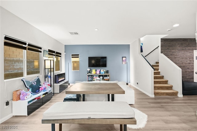 rec room featuring light wood-type flooring, visible vents, baseboards, and recessed lighting