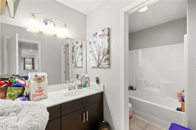 full bathroom featuring  shower combination, vanity, toilet, and tile patterned floors