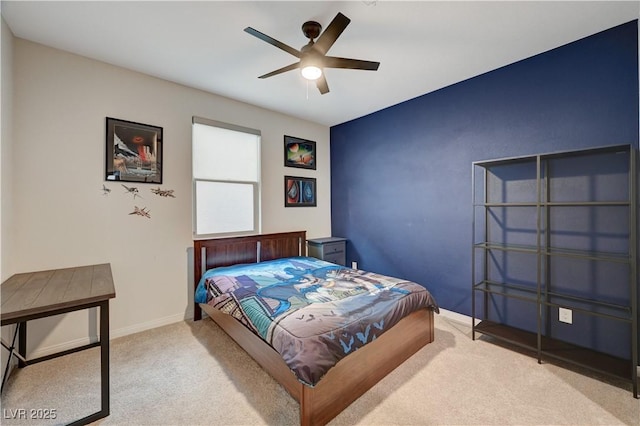 bedroom featuring light carpet, ceiling fan, and baseboards