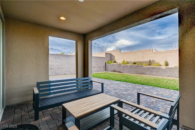 view of patio featuring outdoor dining space and a fenced backyard