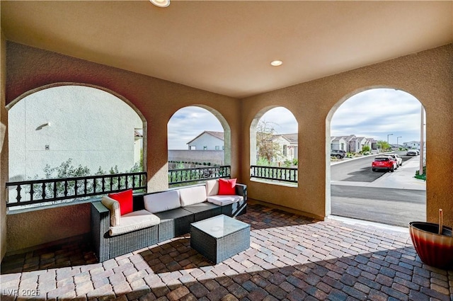 view of patio / terrace with a residential view and an outdoor living space