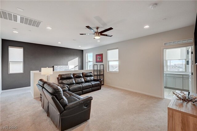 living room with recessed lighting, visible vents, light carpet, ceiling fan, and baseboards