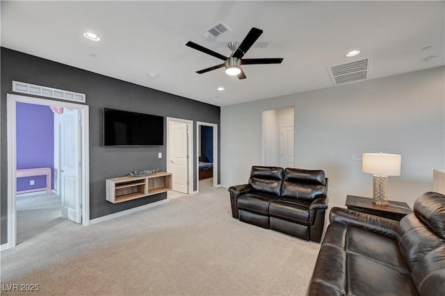 living area featuring light carpet, ceiling fan, visible vents, and recessed lighting