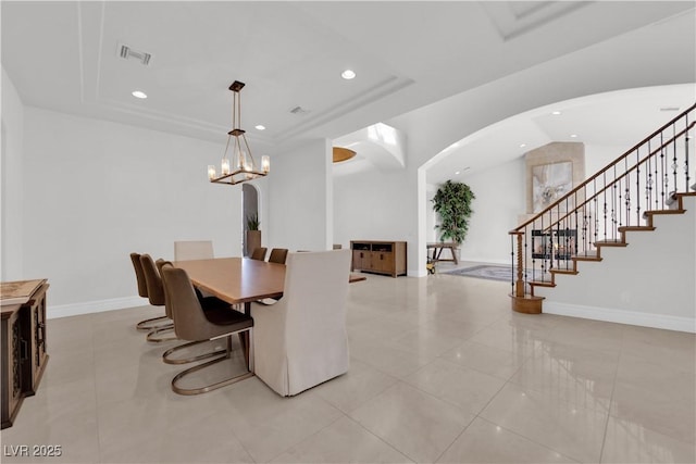 dining space with arched walkways, visible vents, stairway, and recessed lighting