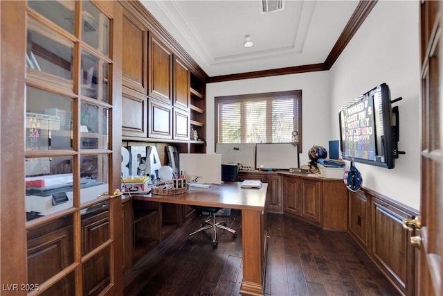 office space featuring a wainscoted wall, visible vents, dark wood-type flooring, and crown molding