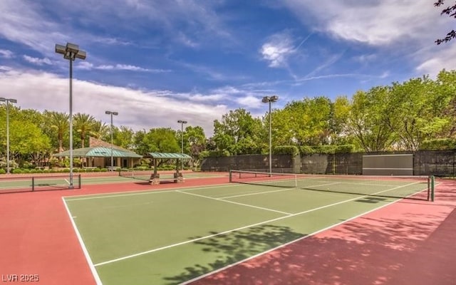 view of tennis court with fence