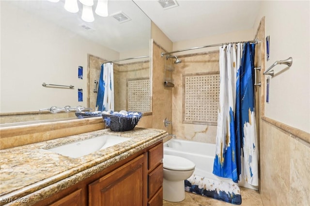 full bathroom with toilet, shower / tub combo, visible vents, and vanity