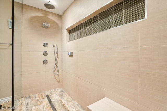 bathroom featuring tiled shower