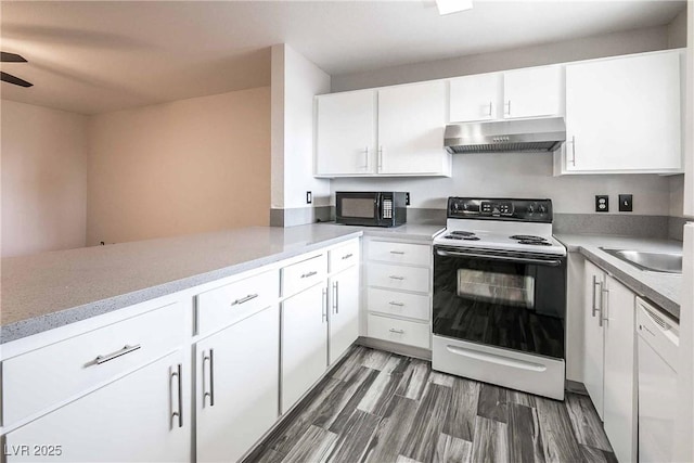 kitchen featuring range with electric cooktop, black microwave, white cabinetry, and under cabinet range hood