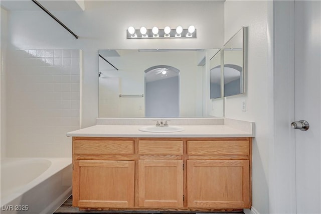 bathroom featuring vanity and shower / tub combination