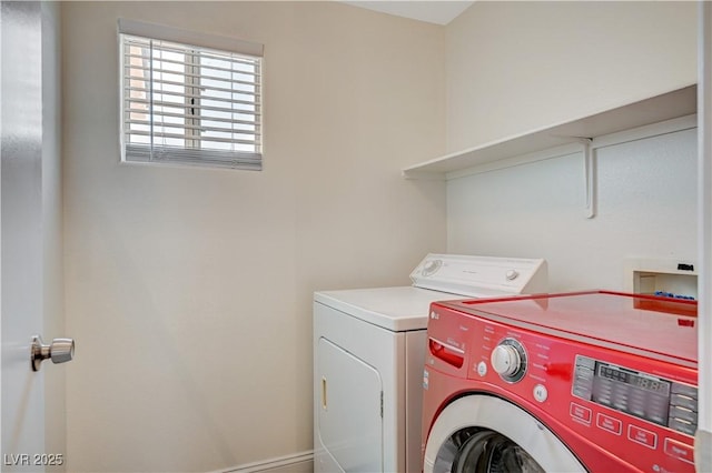 clothes washing area with laundry area and washing machine and clothes dryer