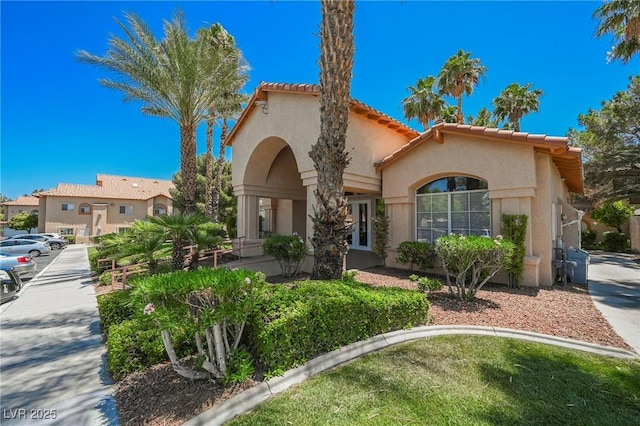 mediterranean / spanish-style home featuring stucco siding