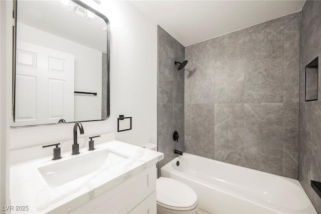 full bathroom featuring visible vents, shower / bath combination, vanity, and toilet