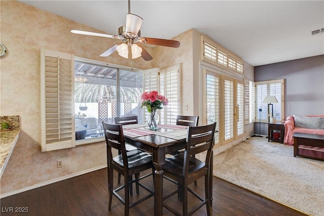 dining room with visible vents, dark wood finished floors, baseboards, and ceiling fan