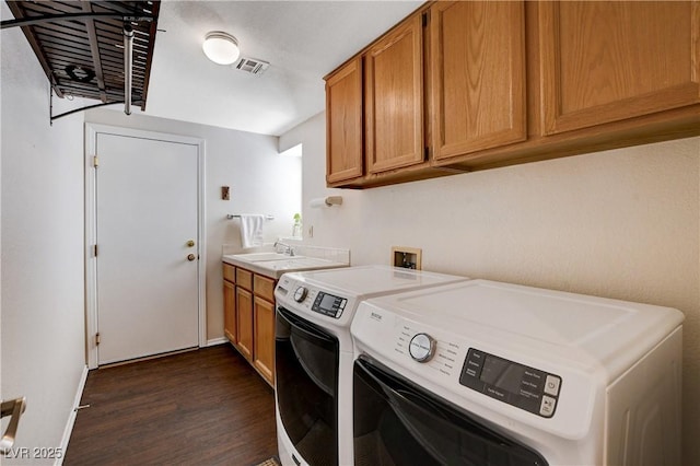 7624 Nocturne Ct, Las Vegas, NV 89128 - laundry room featuring washing machine and clothes dryer, dark wood-style flooring, cabinet space, and baseboards