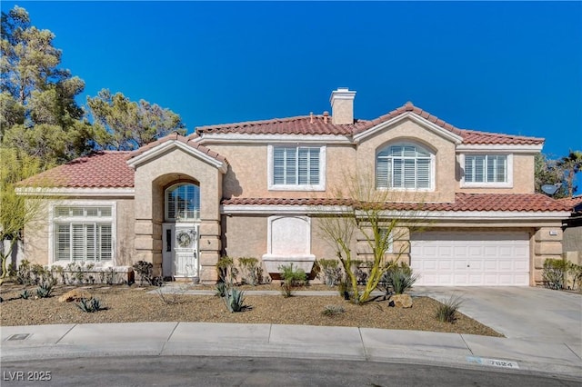 mediterranean / spanish home featuring a tiled roof, a chimney, and stucco siding