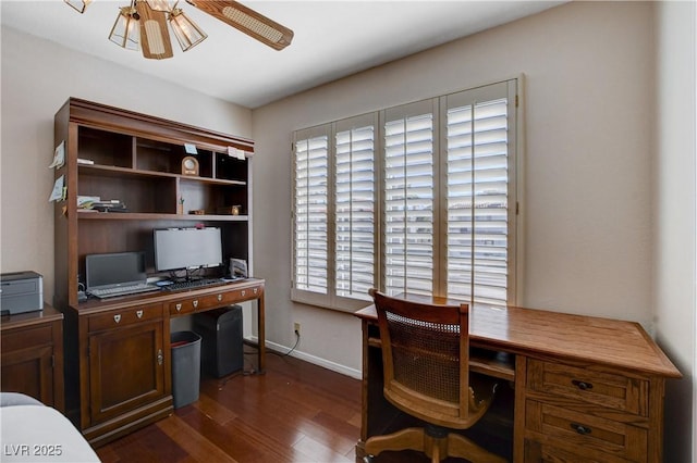 office space with dark wood finished floors, ceiling fan, and baseboards