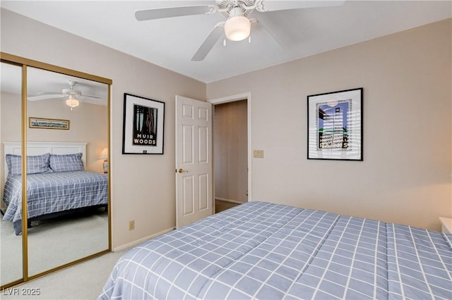 bedroom with carpet, ceiling fan, and a closet