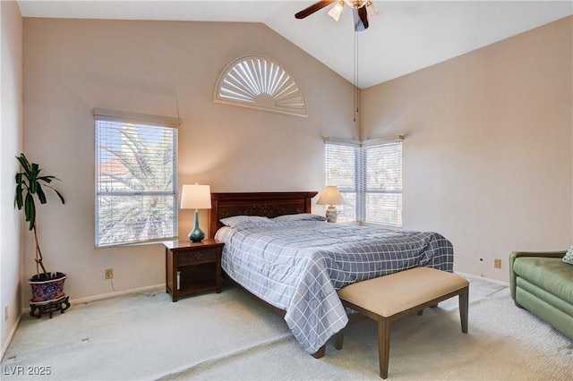 carpeted bedroom featuring high vaulted ceiling, baseboards, and a ceiling fan