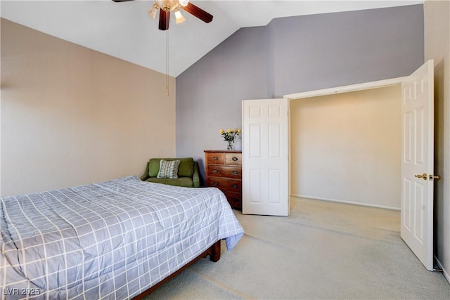 carpeted bedroom featuring ceiling fan and vaulted ceiling