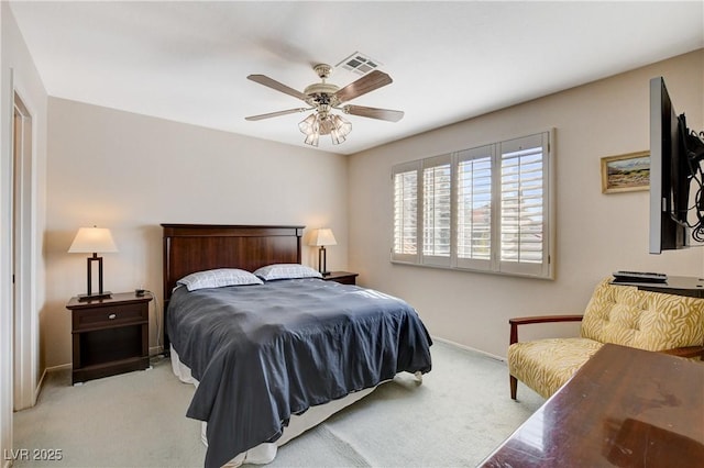 bedroom with baseboards, a ceiling fan, visible vents, and light colored carpet